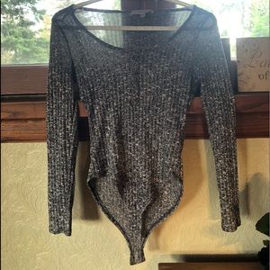 A grey light knit scoop body suit